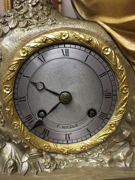 antique figural clock