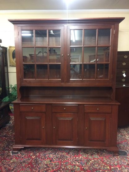 Nice vintage hutch cabinet in cherry wood, made by the Tom Seely Furniture Company. This two piece cherry hutch cabinet has a nice look and shows good quality.