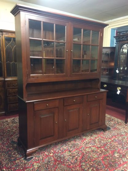 Nice vintage hutch cabinet in cherry wood, made by the Tom Seely Furniture Company. This two piece cherry hutch cabinet has a nice look and shows good quality.