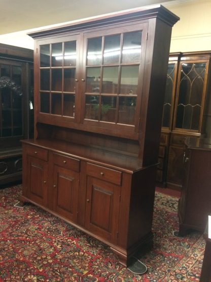 Nice vintage hutch cabinet in cherry wood, made by the Tom Seely Furniture Company. This two piece cherry hutch cabinet has a nice look and shows good quality.